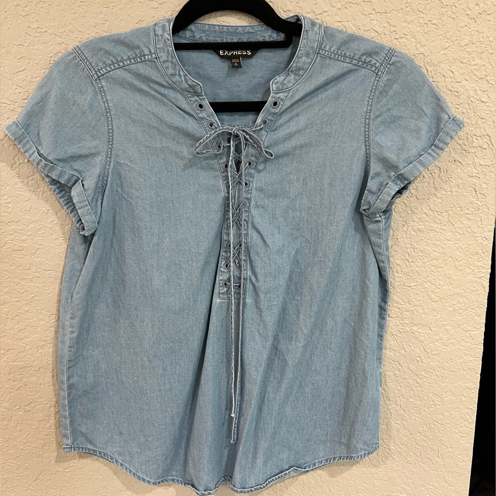 Express denim top with lace up corset detail. Size S